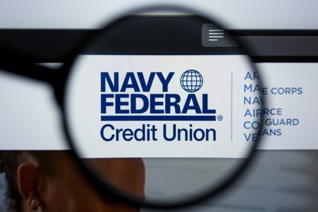 Navy Federal Credit Union logo under a magnifying glass
