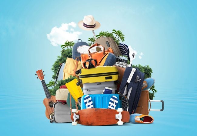 Vacation and travel concept with a suitcases and other accessories