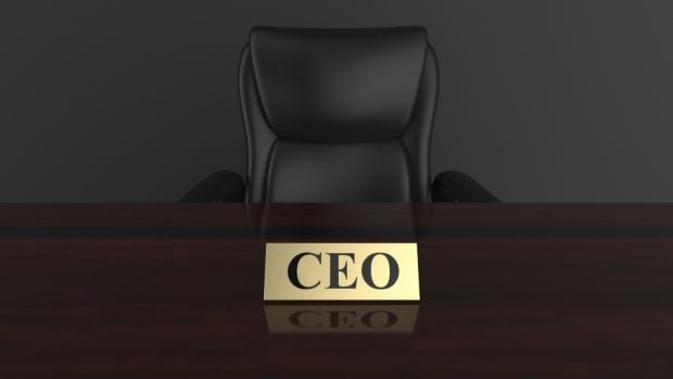 Empty chair with CEO name plate on the desk