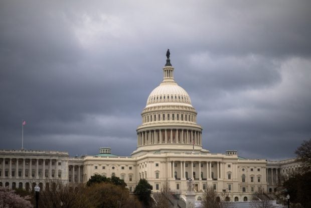 U.S. Capitol building under dark sky