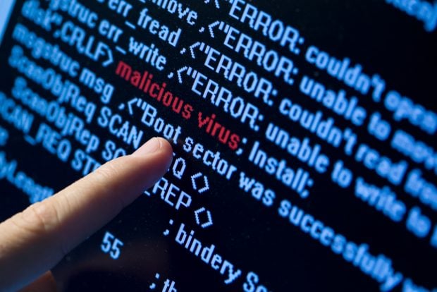 Finger pointing to virus code imbedded into programming code