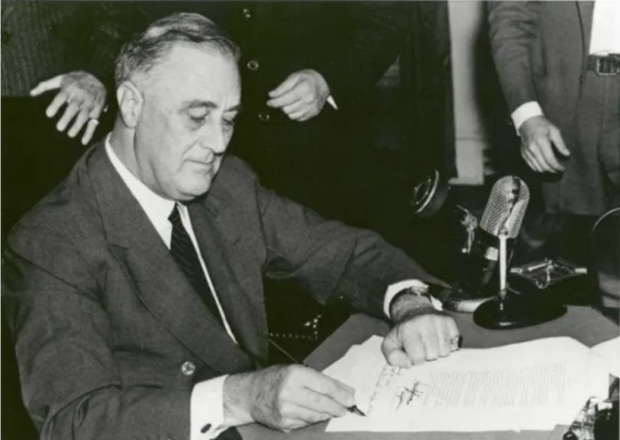 Pres. Roosevelt signs the Federal Credit Union Act into law on June 26, 1934. Credit/National Archives