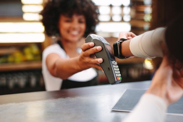 Person paying with an Apple Watch