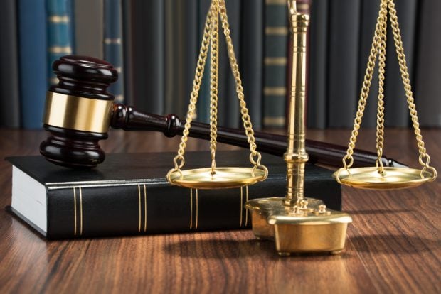Jusge's gavel, law book and scales of justice