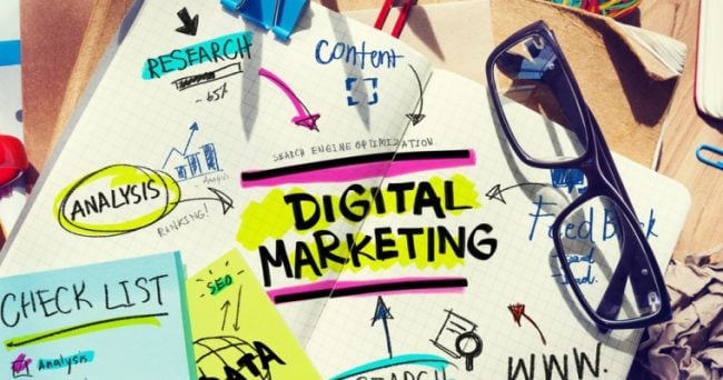 digital marketing concepts written on notebook