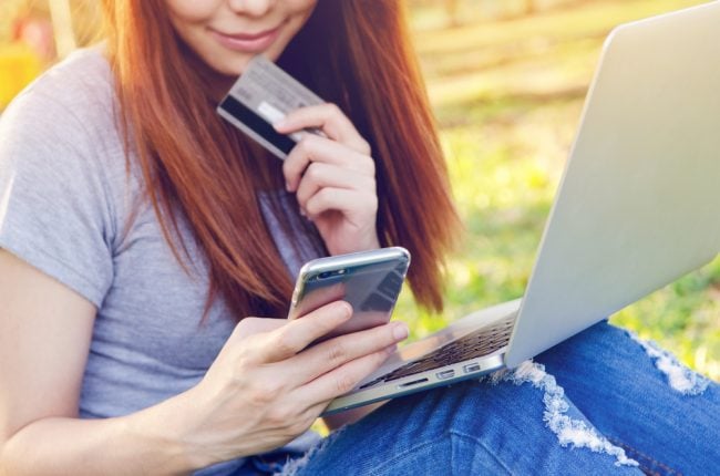 woman with credit card, laptop and smartphone