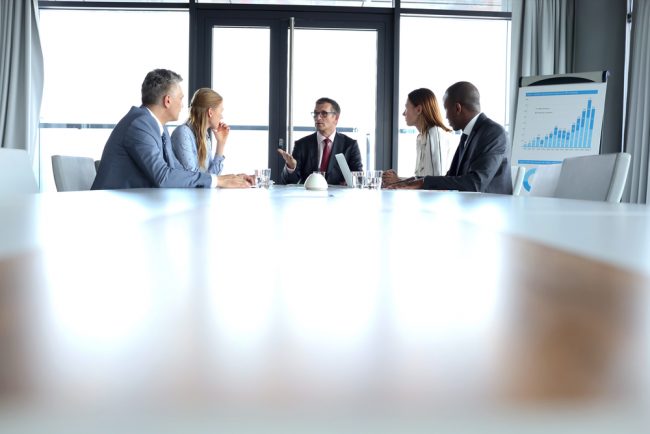 executives sitting at board meeting