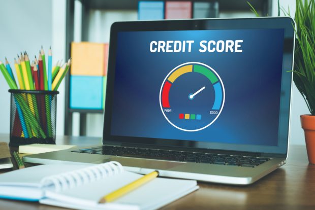 laptop screen showing a high credit score
