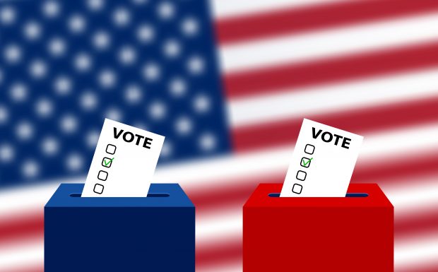 red and blue voting boxes with American flag backdrop
