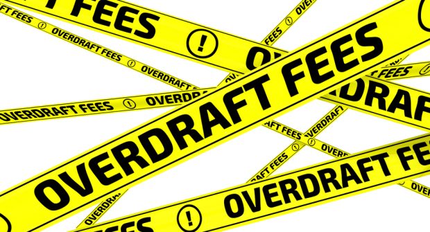 yellow tape with the words "overdraft fees" printed on it