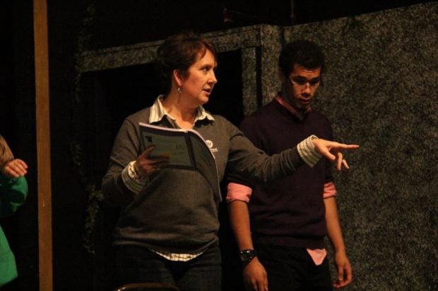 Point West CU President/CEO Amy Nelson directs young performers during a rehearsal.