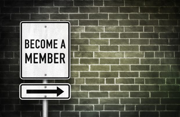 Sign reading "Become a Member" with an arrow pointing to the right.
