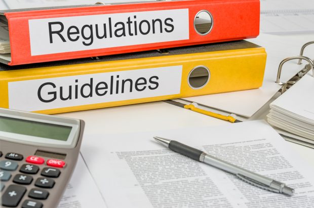Binders full of regulatory guidelines.
