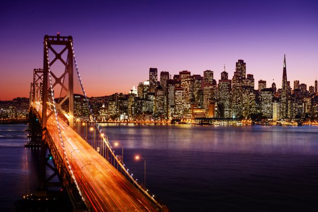 san francisco skyline and bridge at dusk.