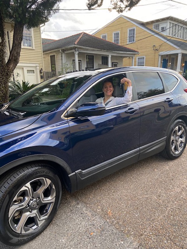 In New Orleans, Margaret Crews Baddour shows off her new car.