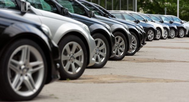 cars in a line at a dealership