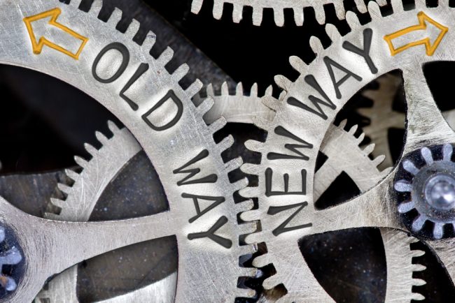 Gears with "old way" and "new way" text