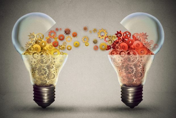 Two light bulbs with ideas coming out of them.