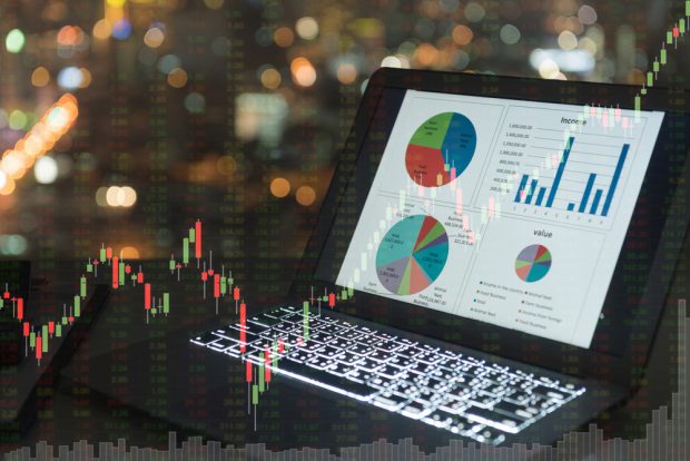 laptop screen showing economic charts