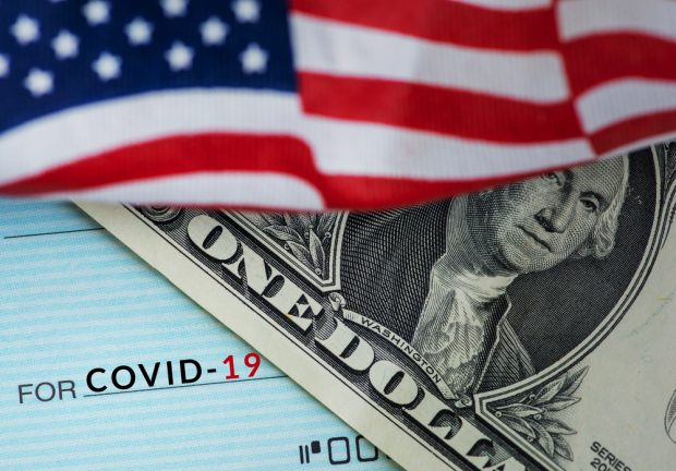 economic relief with a check and the U.S. flag