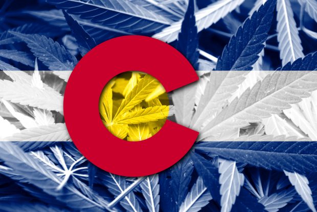 Colorado State flag on cannabis background