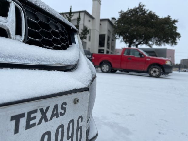 Snow and ice covering vehicles in Dallas on Feb. 16, 2021.