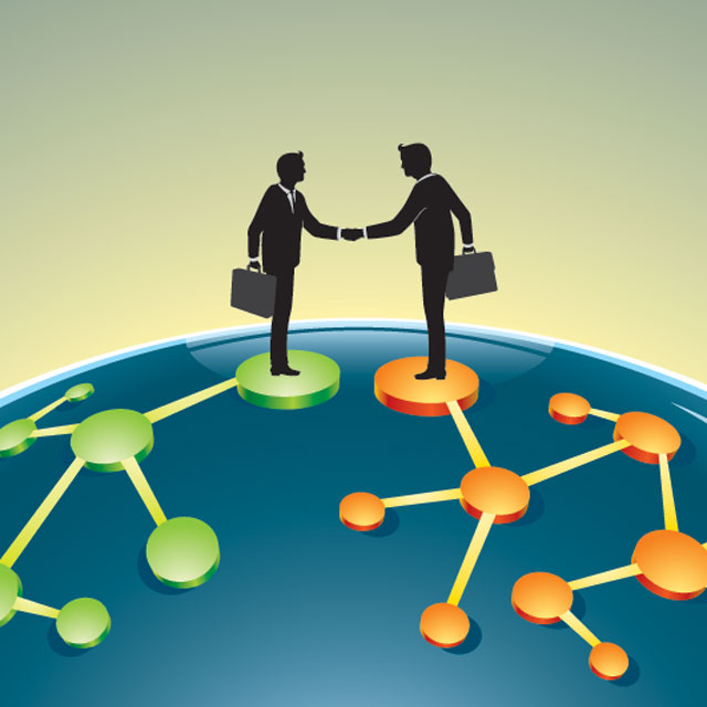 two people shaking hands over financial deal.