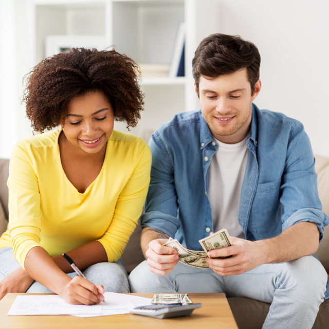 young couple looking at finances