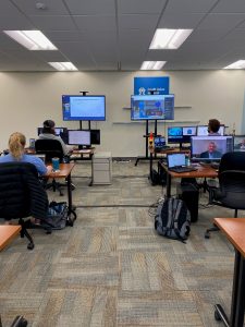 Team members monitor sessions at CUNA's office in Madison, Wis.