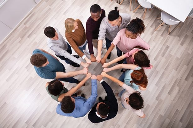 People Hands Joining Their Fist To Form Circle