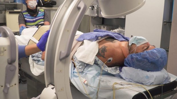 Joe Meritt, a Marine Corps combat veteran and artist, is prepped for the Stellate Ganglion Block (SGB) procedure at the Stella Center in Chicago, Ill., who was featured in PenFed's video series that recently won seven Emmy Awards.