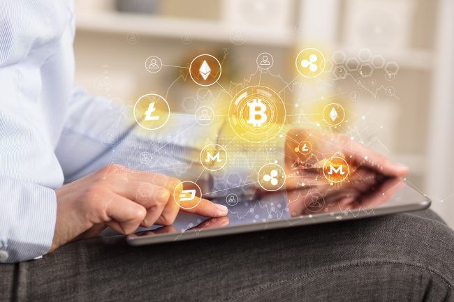 Business woman using tablet with cryptocurrency bitcoin link network concept