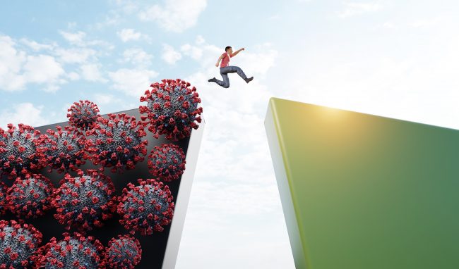 End of Coronavirus Covid-19 virus pandemic. Man jumping to new normal world concept