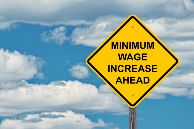 Minimum Wage Increase Ahead Caution Sign Blue Sky Background