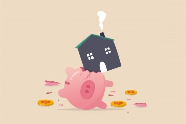 House expense and cost, too expensive payment or high interest rate mortgage concept, heavy house broke savings piggybank metaphor of too much payment 