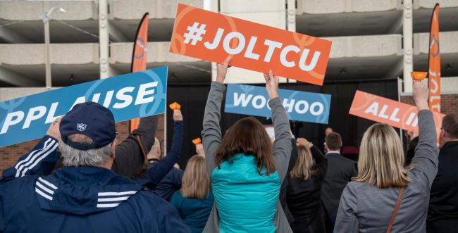 Community members celebrate the opening of the new Jolt Credit Union Event Park in Saginaw, Mich.