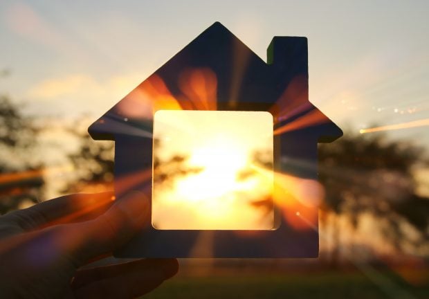 Image of vintage house in the grass, garden or park at sunset light