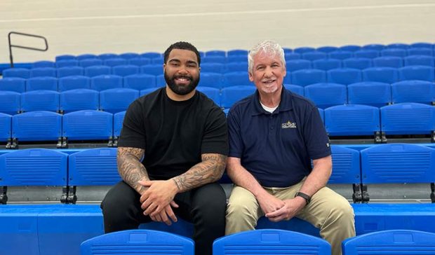 Gable Steveson and SPIRE Credit Union President/CEO Dan Stoltz. (Photo credit: SPIRE Credit Union.)