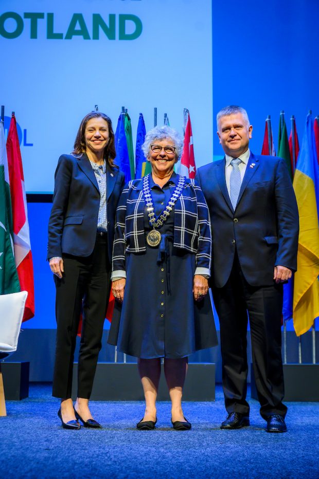 WOCCU Board Chair Diana Dykstra (center), with outgoing Chair Rafal Matusiak and President and CEO Elissa McCarter LaBorde (Photo Credit: Alan Peebles).