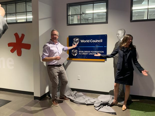 Mark Meyer, Filene CEO and Elissa McCarter LaBorde, WOCCU President/CEO unveil the new WOCCU and Worldwide Foundation office sign in Madison, Wis. on Sept. 21, 2022.