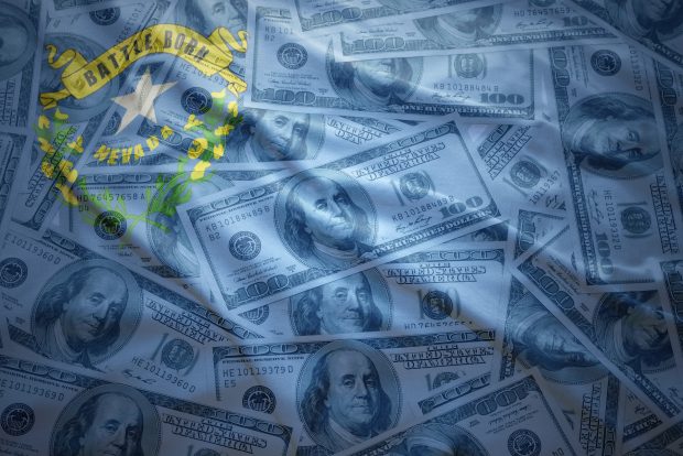 colorful waving nevada state flag on a american dollar money background