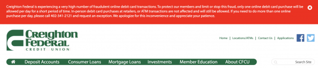 Red alert message at the top of Creighton Federal Credit Union's website. 