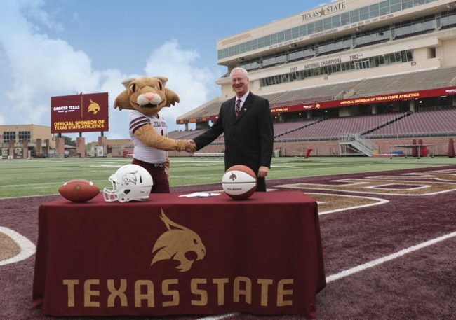 Greater Texas CU President/CEO Howard Baker with Boko the Bobcat
