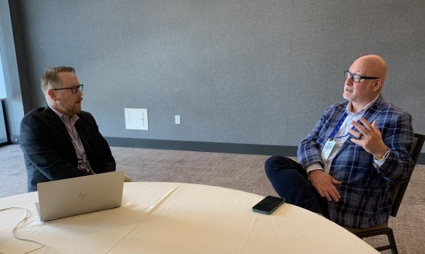 Michael Ogden (left) from CU Times interviews Scott Young with PSCU during the Member Forum in Tampa, Fla.