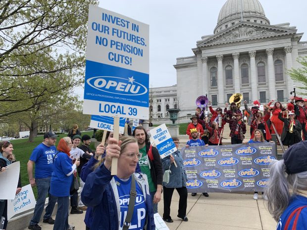 Union employees with CUNA Mutual Group hold a rally at the Wisconsin State Capitol in Madison, Wis. on Saturday, May 6, 2023. 