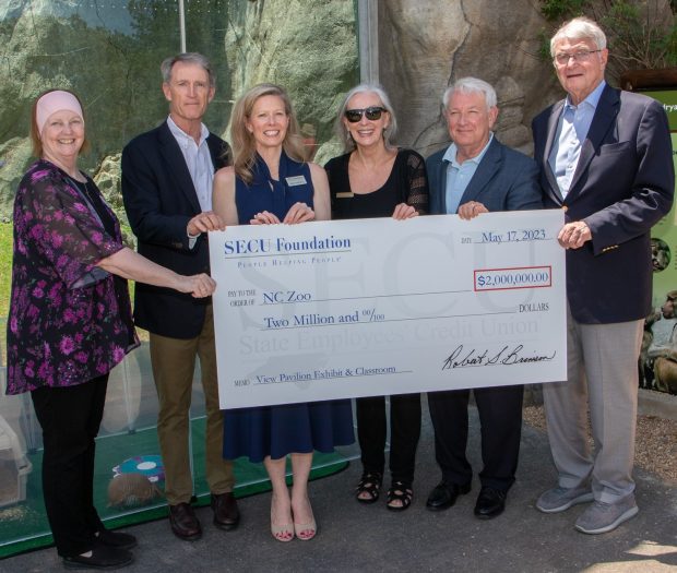 Left to right holding check is Pat Simmons, director and CEO, North Carolina Zoo; John Ruffin, board chair, NC Zoo Society; Jama Campbell, executive director, SECU Foundation; Cheryl Armstrong, executive director, NC Zoo Society; Bob Brinson, board chair, SECU Foundation; and Smedes York, a campaign cabinet leader, NC Zoo Society. (Source: SECU Foundation).