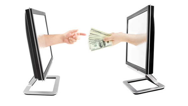 hand handing money through one monitor screen to another