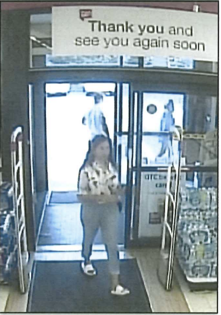 Video surveillance photo, included in the criminal complaint, of Massarone walking into a Walgreen's on July 21.