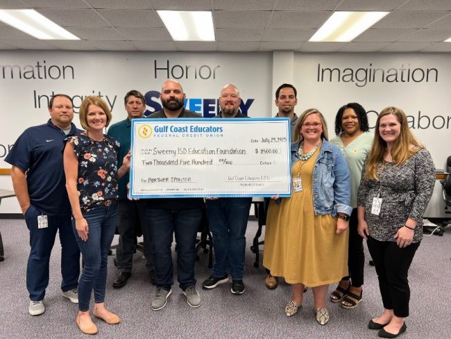 GCEFCU employees present a check to the Sweeny ISD Education Foundation