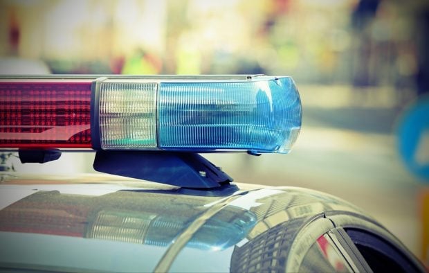 Red and blue police lights on top of a police car